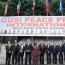 Laureates at Banner with Nations Flags