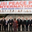 Laureates in front of Banner